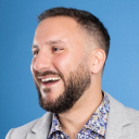 Bobak against a light blue background